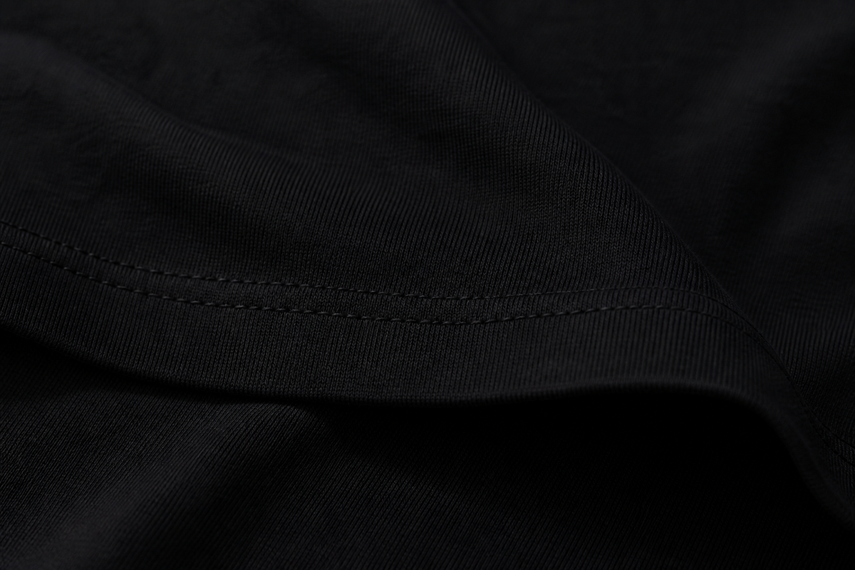 Close-up of black Dilligaf cotton fabric