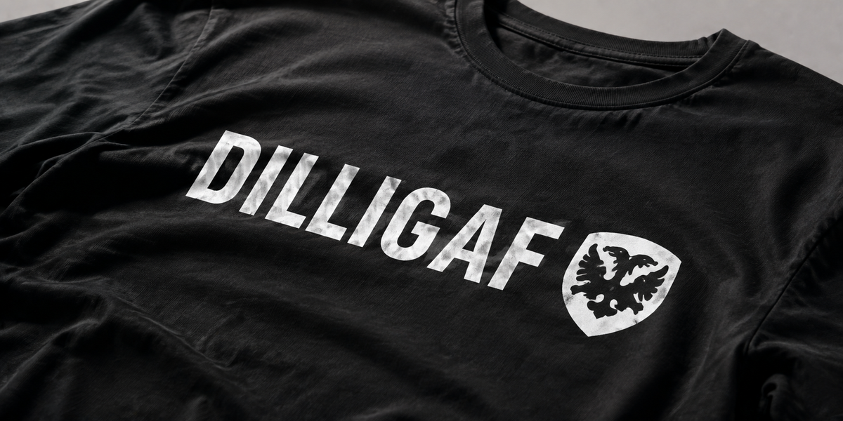 Close-up of the Classic Dilligaf T-shirt print and black cotton fabric