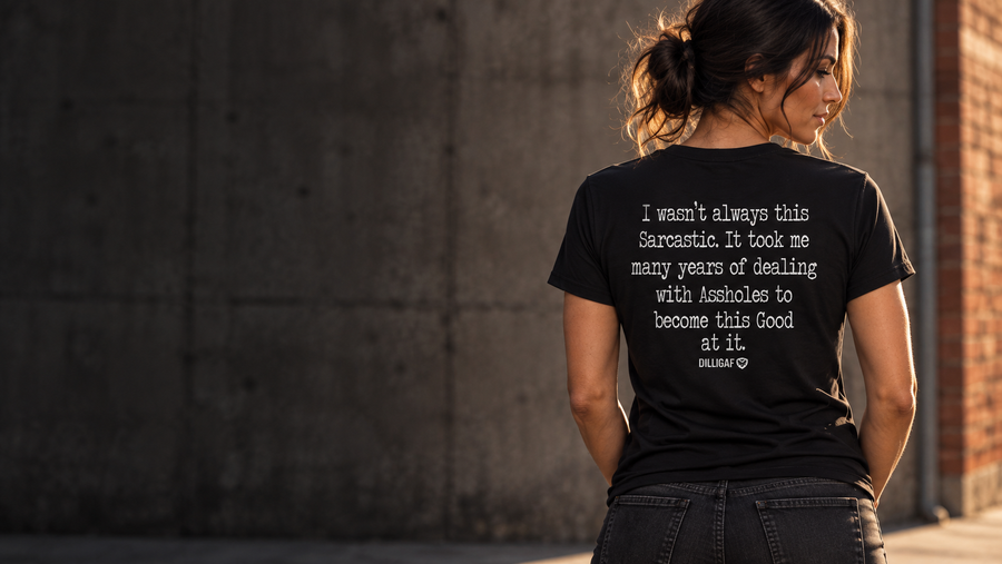 Woman wearing the black Dilligaf Sarcastic shirt, original back print in warm evening light